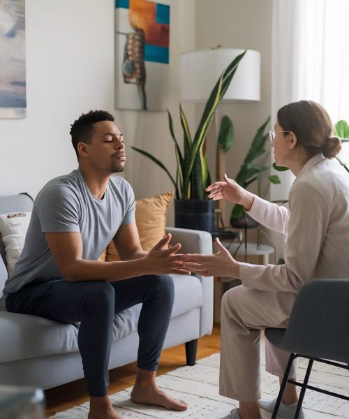 psychologist-teaching-breathing-exercise-stressed-patient-therapy-session-home